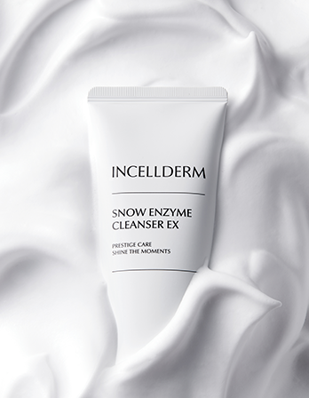 Incellderm Snow Enzyme Cleanser EX tube on a white fabric background