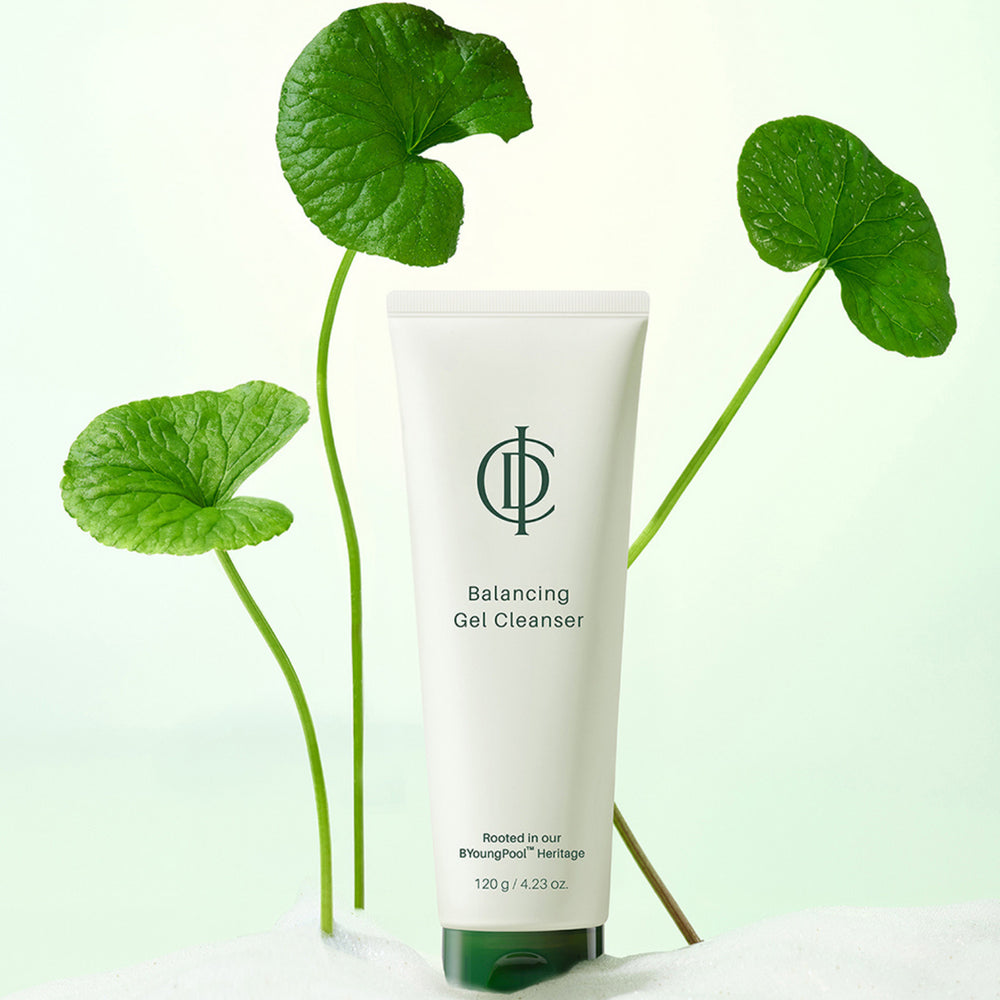 Tube of Balancing Gel Cleanser with green leaves on a light green background